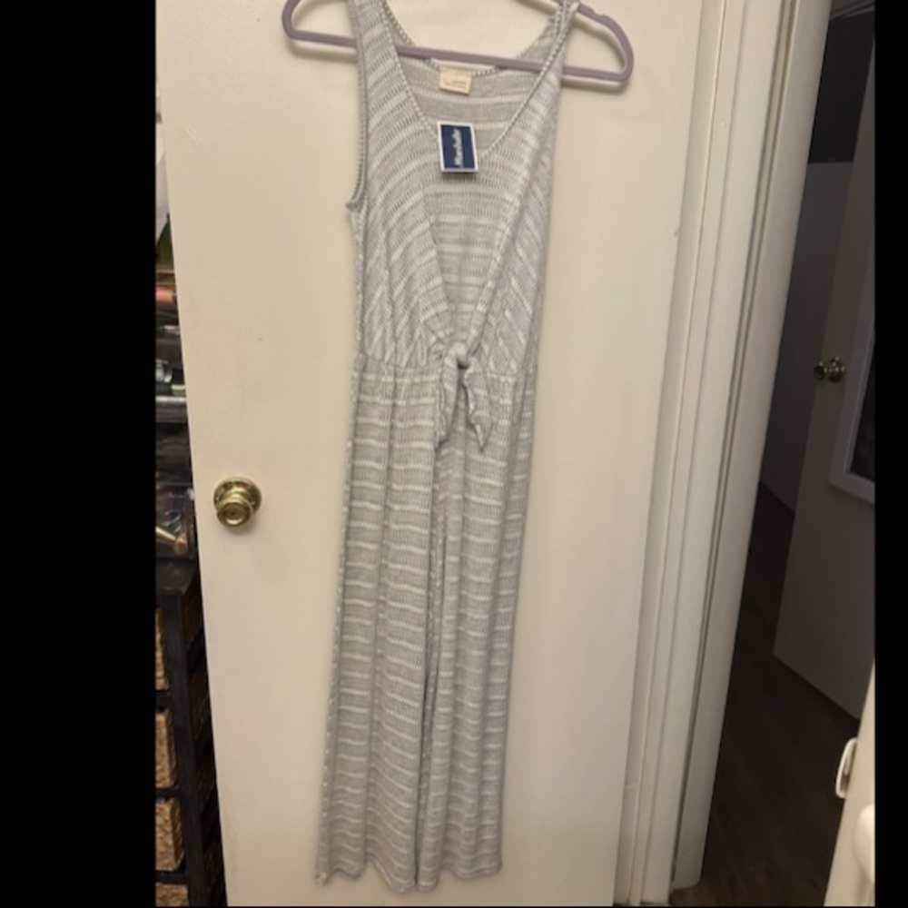 Grey jumpsuit, sleeveless, soft fabric. Size small. New with tags